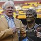 FILE - Former Washington Redskins general manager Bobby Beathard poses with his Hall of Fame trophy during halftime of an NFL football game between the Houston Texans and the Washington Redskins, Nov. 18, 2018 in Landover, Md. The four-time Super Bowl winning executive has died. He was 86. A spokesperson for the Washington Commanders said Beathard&#39;s family told the team he died earlier this week at his home in Franklin, Tennessee. (AP Photo/Alex Brandon, file)