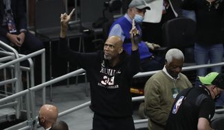 Kareem Abdul-Jabbar reacts during the first half of Game 4 of basketball&#39;s NBA Finals between the Milwaukee Bucks and the Phoenix Suns, Wednesday, July 14, 2021, in Milwaukee. Kareem Abdul-Jabbar&#39;s reign atop the NBA career scoring list is about to end after nearly four decades. LeBron James is on the verge of passing Abdul-Jabbar for the record that he&#39;s held since 1984.(AP Photo/Aaron Gash, File) **FILE**