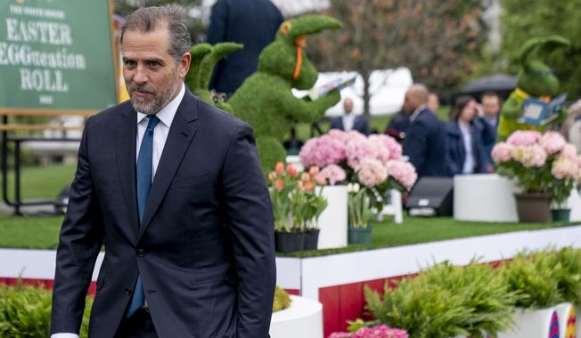 Hunter Biden, the son of President Joe Biden, left, chases after his son Beau during the White House Easter Egg Roll at the White House, Monday, April 18, 2022, in Washington. (AP Photo/Andrew Harnik) **FILE**