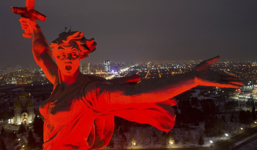 A giant statue of "Mother of the Homeland" is seen atop the memorial site on Mamayev Hill illuminated for marking the 80th anniversary of the Soviet victory in the battle of Stalingrad in the southern Russian city of Volgograd, once known as Stalingrad, Russia, Wednesday, Feb. 1, 2023. The battle of Stalingrad turned the tide of World War II and is regarded as the bloodiest battle in history, with the death toll for soldiers and civilians estimated at about 2 million. (AP Photo)