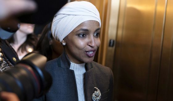 Rep. Ilhan Omar, D-Minn., leaves the House chamber at the Capitol in Washington, Thursday, Feb. 2, 2023. House Republicans have voted to oust Omar from the House Foreign Affairs Committee. The vote in a raucous session on Thursday to remove the Somali-born Muslim lawmaker came after her past comments critical of Israel.  (AP Photo/Jose Luis Magana)