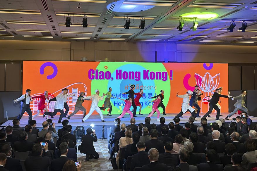 Dancers perform at a kickoff event for Hong Kong's tourism campaign "Hello Hong Kong" in Hong Kong, Thursday, Feb. 2, 2023. Hong Kong will give away air tickets and vouchers to woo tourists back to the international financial hub, racing to catch up with other popular travel destinations in a fierce regional competition. (AP Photo/Kanis Leung)