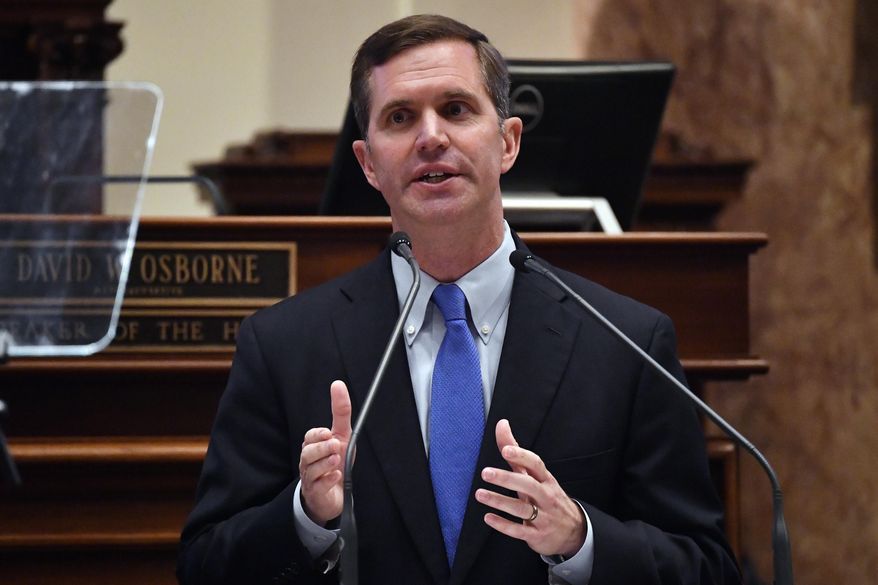 Kentucky Gov. Andy Beshear delivers his State of the Commonwealth speech the floor of the Kentucky House of Representatives, Jan. 4, 2023, in Frankfort, Ky. Beshear said Thursday, Feb. 2, 2023, that some Kentuckians who signed up for Medicaid during the COVID-19 pandemic will soon have to shop around to maintain health insurance coverage. (AP Photo/Timothy D. Easley, File)