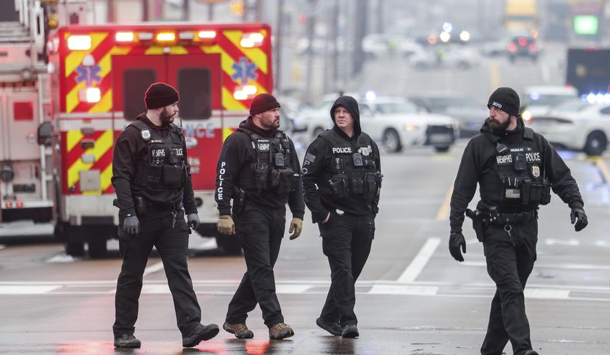 Law enforcement personnel work at the scene of a shooting at a Tennessee library, Thursday, Feb. 2, 2023, in Memphis. A different shooting at a gun violence intervention meeting in Memphis on Wednesday, April 9, 2025, left one man dead, one critically injured and four others hospitalized with non-serious injuries. (Patrick Lantrip/Daily Memphian via AP)