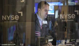 Traders work on the floor at the New York Stock Exchange in New York, Wednesday, Feb. 1, 2023. (AP Photo/Seth Wenig) **FILE**