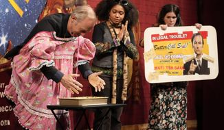 Actor Bob Odenkirk pauses after casting his hands in a tray of butter during a roast while being honored as Man of the Year by Harvard University&#39;s Hasty Pudding Theatricals, Thursday, Feb. 2, 2023, in Cambridge, Mass. (AP Photo/Charles Krupa)