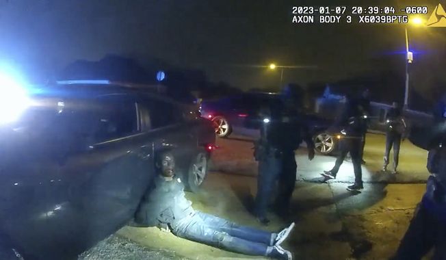 Thie image from video released on Jan. 27, 2023, by the City of Memphis, shows Tyre Nichols leaning against a car after a brutal attack by five Memphis police officers on Jan. 7, 2023, in Memphis, Tenn. Nichols died on Jan. 10. The five officers have since been fired and charged with second-degree murder and other offenses. (City of Memphis via AP)