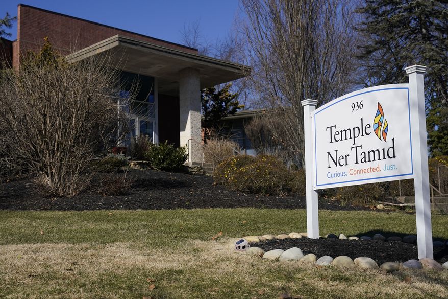 Temple Ner Tamid is seen in Bloomfield, N.J., Thursday, Feb. 2, 2023. A man suspected of throwing a Molotov cocktail at the front door of the synagogue in northern New Jersey last weekend has been taken into custody. Nicholas Malindretos is charged with attempted use of fire to damage and destroy a building. (AP Photo/Seth Wenig)