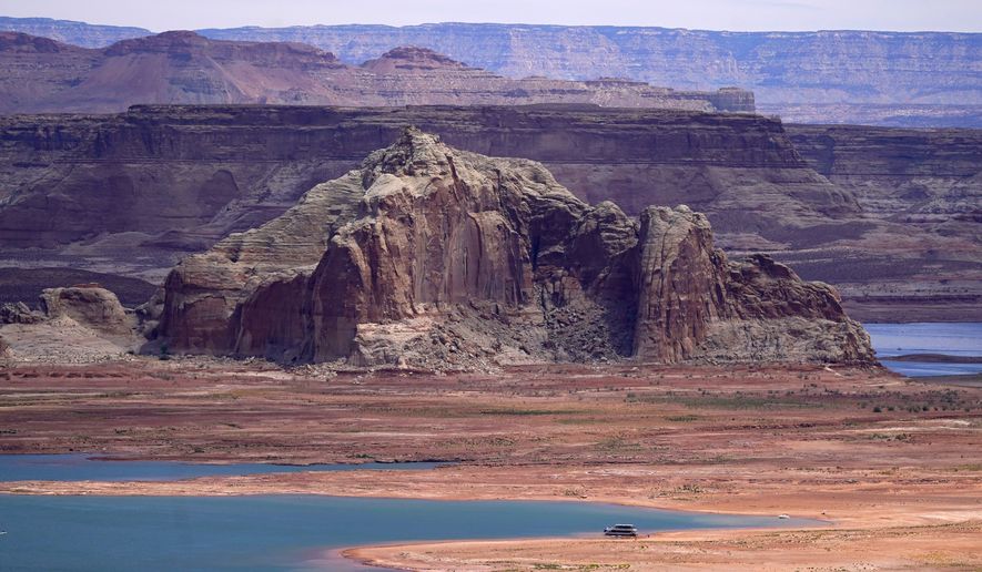 Low water levels at Wahweap Bay at Lake Powell along the Upper Colorado River Basin are shown, June 9, 2021, at the Utah and Arizona border at Wahweap, Ariz. The Biden administration announced Thursday, Feb. 2, 2023, that 15 Native American tribes will get a total of $580 million in federal money this year for water rights settlements. (AP Photo/Ross D. Franklin, File)