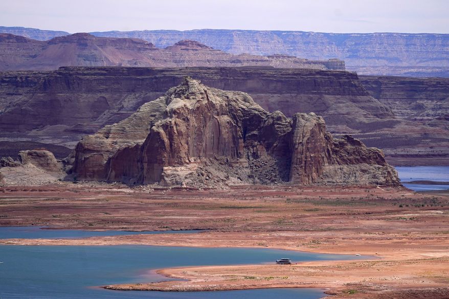 Low water levels at Wahweap Bay at Lake Powell along the Upper Colorado River Basin are shown, June 9, 2021, at the Utah and Arizona border at Wahweap, Ariz. The Biden administration announced Thursday, Feb. 2, 2023, that 15 Native American tribes will get a total of $580 million in federal money this year for water rights settlements. (AP Photo/Ross D. Franklin, File)
