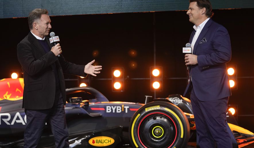 Christian Horner, team principal of the Red Bull Formula One team, left, talks while Ford CEO Jim Farley, right, listens during an Oracle Red Bull Racing event in New York, Friday, Feb. 3, 2023. Ford will return to Formula One as the engine provider for Red Bull Racing in a partnership announced Friday that begins with immediate technical support this season and engines in 2026. (AP Photo/Seth Wenig)