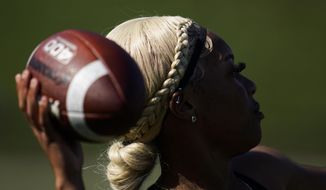Sa&#39;Mir Braccey, 17, throws a pass as she tries out for the Redondo Union High School girls flag football team on Thursday, Sept. 1, 2022, in Redondo Beach, Calif. California officials are expected to vote Friday on the proposal to make flag football a girls&#39; high school sport for the 2023-24 school year. (AP Photo/Ashley Landis, File)