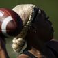 Sa&#39;Mir Braccey, 17, throws a pass as she tries out for the Redondo Union High School girls flag football team on Thursday, Sept. 1, 2022, in Redondo Beach, Calif. California officials are expected to vote Friday on the proposal to make flag football a girls&#39; high school sport for the 2023-24 school year. (AP Photo/Ashley Landis, File)