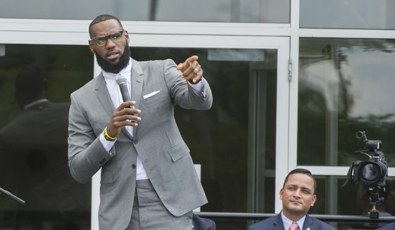 LeBron James speaks at the opening ceremony for the I Promise School in Akron, Ohio, Monday, July 30, 2018. The I Promise School is supported by The LeBron James Family Foundation and is run by the Akron Public Schools. LeBron James is soon going to be in the NBA record books as the most prolific scorer ever. But for all his accomplishments on the basketball court, James’ ambitious pursuits off the court may ultimately distinguish his legacy from other superstar athletes. (AP Photo/Phil Long, File)