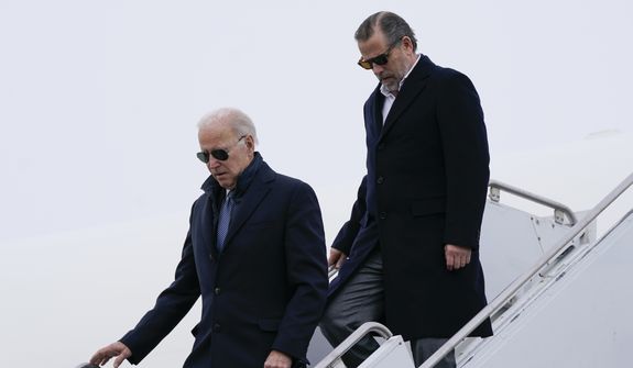 President Joe Biden and his son Hunter Biden step off Air Force One, Saturday, Feb. 4, 2023, at Hancock Field Air National Guard Base in Syracuse, N.Y. The Bidens are in Syracuse to visit with family members following the passing of Michael Hunter, the brother of the president&#39;s first wife, Neilia Hunter Biden. (AP Photo/Patrick Semansky)