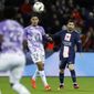 PSG&#39;s Lionel Messi, right, eyes the ball next to Toulouse&#39;s Fares Chaibi during the French League One soccer match between Paris Saint-Germain and Toulouse, at the Parc des Princes, in Paris, France, Saturday, Feb. 4, 2023. (AP Photo/Lewis Joly)