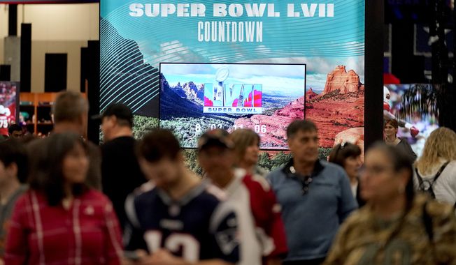 NFL football fans participate in the Super Bowl Experience, Saturday, Feb. 4, 2023, in Phoenix. Super Bowl LVII will be played in Glendale, Ariz. on Feb 12. (AP Photo/Matt York)