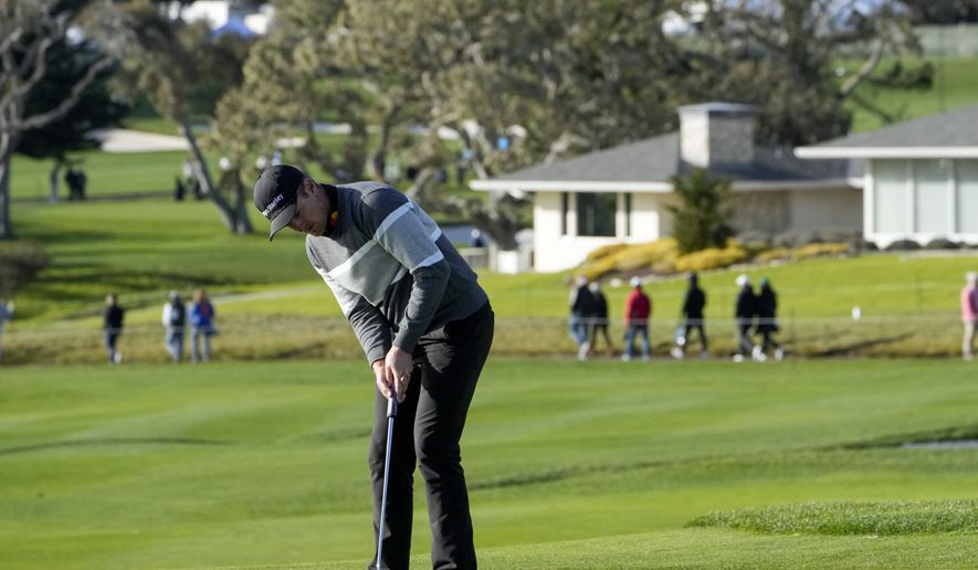 Justin Rose, of England, follows his putt on the fourth green of the Pebble Beach Golf Links during the fourth round of the AT&amp;T Pebble Beach Pro-Am golf tournament in Pebble Beach, Calif., Sunday, Feb. 5, 2023. (AP Photo/Godofredo A. Vásquez)