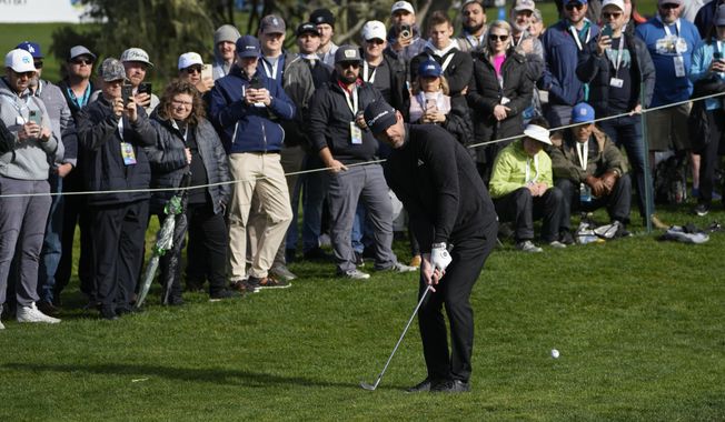 Aaron Rodgers follows his shot onto the 16th green of the Pebble Beach Golf Links during the third round of the AT&amp;T Pebble Beach Pro-Am golf tournament in Pebble Beach, Calif., Sunday, Feb. 5, 2023. (AP Photo/Godofredo A. Vásquez)