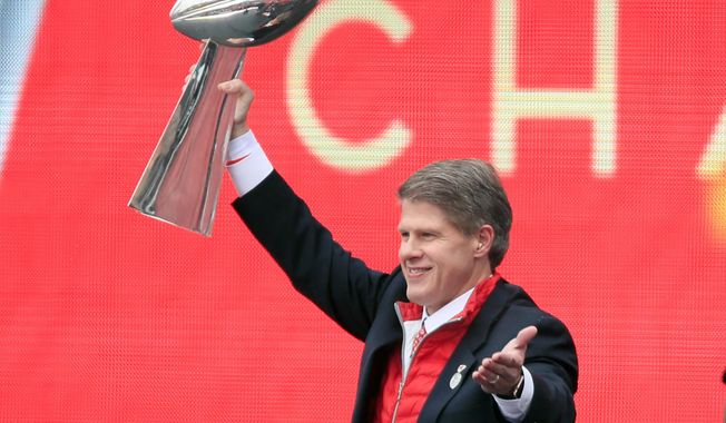 Kansas City Chiefs owner Clark Hunt holds the Super Bowl trophy during a rally in Kansas City, Mo., Wednesday, Feb. 5, 2020. It had been 50 years between Super Bowl trips. The always-pragmatic Hunt uses that stretch in football&#x27;s wilderness to keep the current ride in the proper perspective. (AP Photo/Orlin Wagner, File) **FILE**
