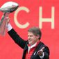 Kansas City Chiefs owner Clark Hunt holds the Super Bowl trophy during a rally in Kansas City, Mo., Wednesday, Feb. 5, 2020. It had been 50 years between Super Bowl trips. The always-pragmatic Hunt uses that stretch in football&#39;s wilderness to keep the current ride in the proper perspective. (AP Photo/Orlin Wagner, File) **FILE**