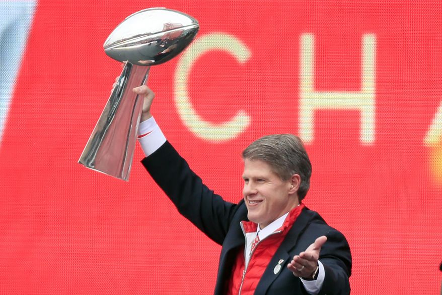 Kansas City Chiefs owner Clark Hunt holds the Super Bowl trophy during a rally in Kansas City, Mo., Wednesday, Feb. 5, 2020. It had been 50 years between Super Bowl trips. The always-pragmatic Hunt uses that stretch in football&#x27;s wilderness to keep the current ride in the proper perspective. (AP Photo/Orlin Wagner, File) **FILE**