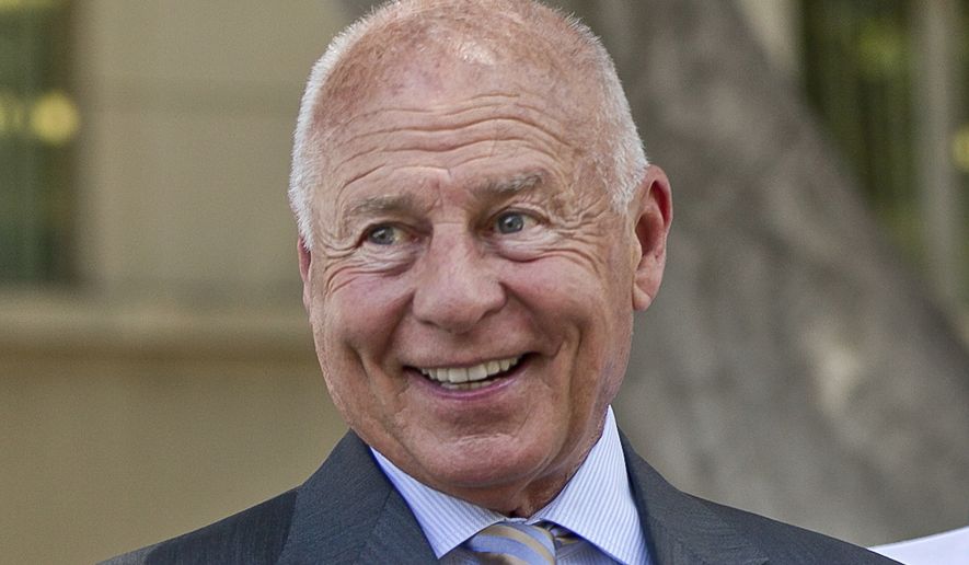 Attorney Tom Girardi smiles outside the Los Angeles courthouse on Wednesday, July 9, 2014. Disbarred attorney Girardi makes his first appearance Monday, Feb. 6, 2023, in federal court on charges that he embezzled millions of dollars from some of the large settlements he won for clients. (AP Photo/Damian Dovarganes, File)