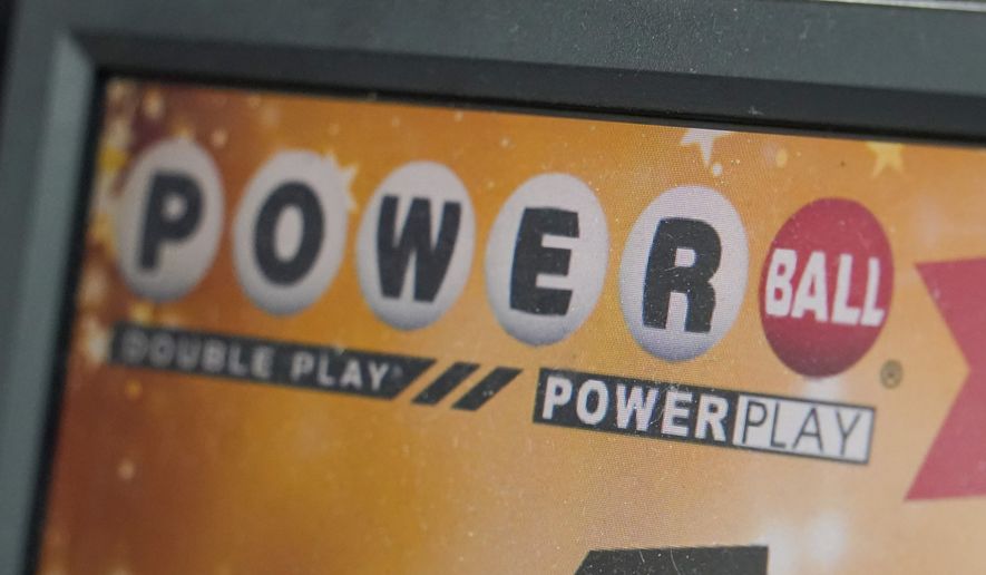 A display panel advertises tickets for a Powerball drawing at a convenience store, Nov. 7, 2022, in Renfrew, Pa. A $747 million Powerball jackpot will be up for grabs for players willing to risk $2 against the long odds of winning the big prize. No one has won the jackpot since November. That has allowed the prize to grow larger with each of the game’s three weekly drawings. It stands as the ninth-largest in U.S. history ahead of a drawing Monday, Feb. 6, 2023. (AP Photo/Keith Srakocic, file)