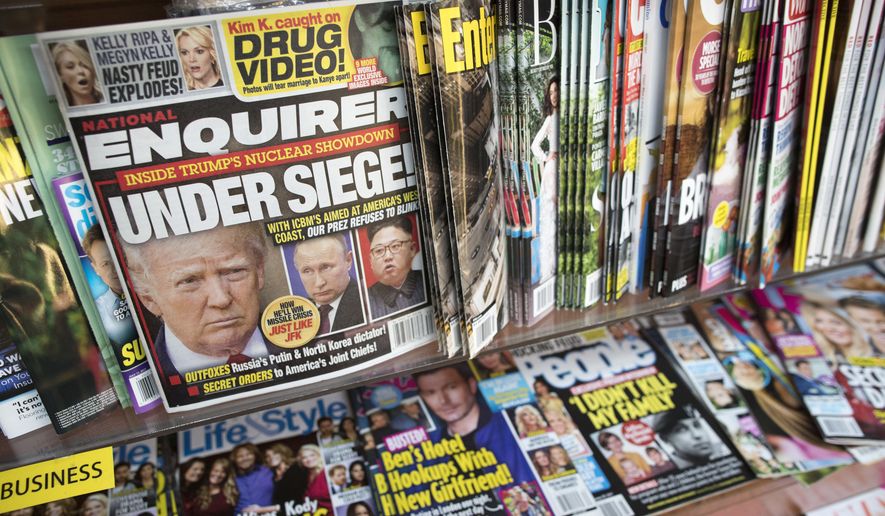 In this July 12, 2017, file photo, an issue of the National Enquirer featuring President Donald Trump on its cover is displayed on a newsstand in a store in New York. VVIP Ventures is buying the U.S. and U.K editions of the National Enquirer, the tabloid that engaged in “catch-and-kill” practices to bury stories about Donald Trump during his presidential campaign. Financial terms were not disclosed. (AP Photo/Mary Altaffer, File)