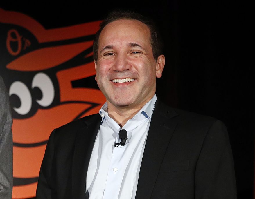 FILE - Baltimore Orioles executive vice president John Angelos smiles after a baseball news conference Nov. 19, 2018, in Baltimore. Orioles CEO John Angelos and his brother Lou agreed to end their fight over a lawsuit in which Lou accused John of seizing control of the team in defiance of their father Peter&#x27;s wishes. (AP Photo/Patrick Semansky, File)