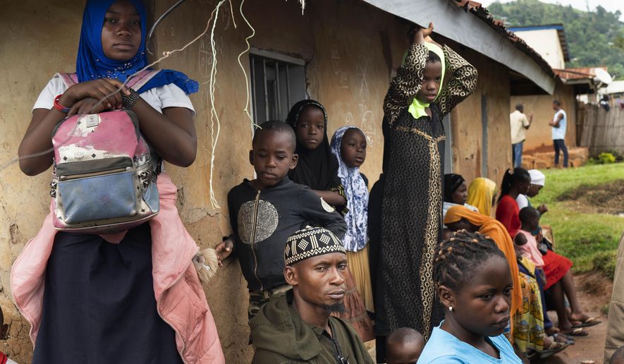 Residents wait in line to receive the Ebola vaccine in Beni, Congo DRC on July 13, 2019. A confidential U.N. report into the alleged missteps by senior World Health Organization in the way they handled a sexual misconduct case during an Ebola outbreak in Congo found their response did not violate the agency’s policies because of what some officials described as a “loophole.” The report, which was submitted to the WHO Director-General on Jan. 2023, and was not released publicly, was obtained by the Associated Press. (AP Photo/Jerome Delay, File)