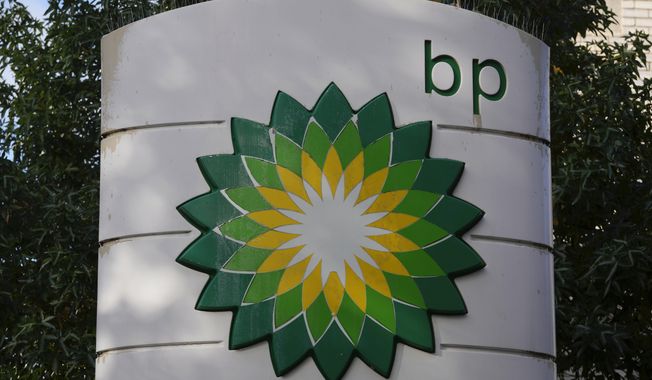 A logo of BP is seen at a gas station in London, on Nov. 1, 2022. British energy company BP reported record annual earnings on Tuesday, Feb. 7, 2023, amid growing calls for the U.K. government to boost taxes on companies profiting from the high price of oil and natural gas after Russia’s invasion of Ukraine. (AP Photo/Kin Cheung, File)