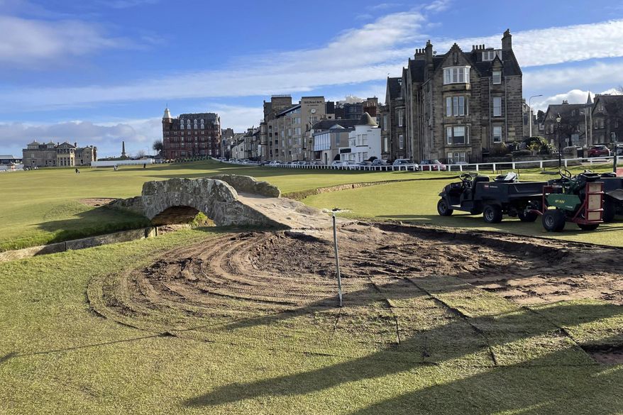 Construction continues to restore the area around the Swilcan Bridge on the 18th hole of the Old Course at St. Andrews on Tuesday, Feb. 7, 2023, from St Andrews, Scotland. What was shaping up as one the biggest controversies in golf this year also turned out to be the shortest one. The outrage began with social media images of the St. Andrews Links Trust extending the start of the bridge to include a circular patio of stones that did not look like they had been there for 700 years. (Sadie Golen via AP)