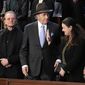 Bono, the Irish lead singer of U2, Paul Pelosi, husband of Rep. Nancy Pelosi, D-Calif., and Oksana Markarova, Ukrainian ambassador to the U.S., arrive in the first lady&#39;s box in the House chamber before President Joe Biden delivers the State of the Union address to a joint session of Congress at the U.S. Capitol, Tuesday, Feb. 7, 2023, in Washington. (AP Photo/Patrick Semansky)