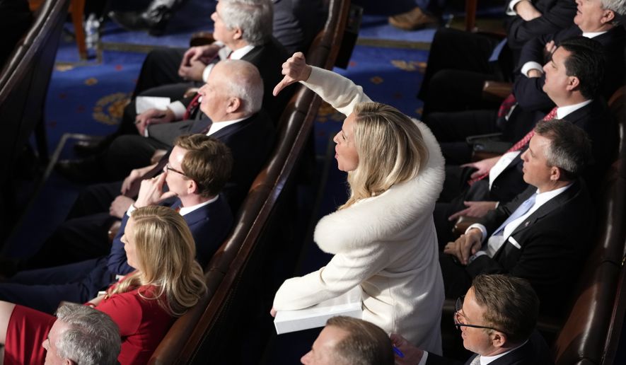 Rep. Marjorie Taylor Greene, R-Ga., reacts as President Joe Biden delivers the State of the Union address to a joint session of Congress at the U.S. Capitol, Tuesday, Feb. 7, 2023, in Washington. (AP Photo/Patrick Semansky)
