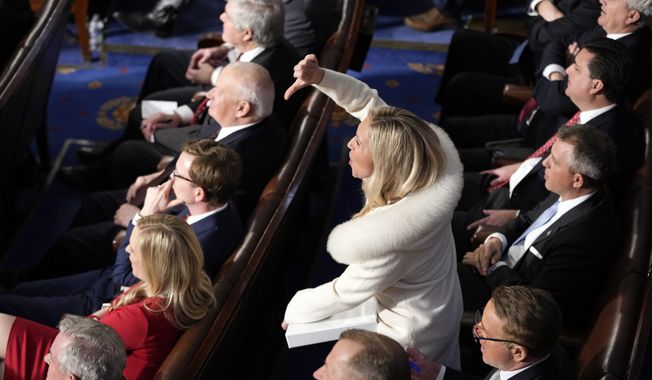 Rep. Marjorie Taylor Greene, R-Ga., reacts as President Joe Biden delivers the State of the Union address to a joint session of Congress at the U.S. Capitol, Tuesday, Feb. 7, 2023, in Washington. (AP Photo/Patrick Semansky)