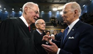 President Joe Biden talks with retired Justice Anthony Kennedy after the State of the Union address to a joint session of Congress at the Capitol, Tuesday, Feb. 7, 2023, in Washington. Retired Justice Stephen Breyer is at center. (Jacquelyn Martin, Pool)