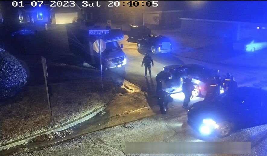 In this image from video released and partially redacted by the city of Memphis, Tenn., on Jan. 27, 2023, Tyre Nichols leans against a car after a brutal attack by five Memphis Police officers on Jan. 7, in Memphis. Officer Demetrius Haley, who is standing bent over in front of Nichols, is seen taking photographs of Nichols, which he sent to other officers and a female acquaintance. The new revelation about Haley&#x27;s actions were released Tuesday, Feb. 7, in documents that provide a scathing account of what authorities called the “blatantly unprofessional” conduct of the officers involved in the fatal beating of Nichols. (City of Memphis via AP)
