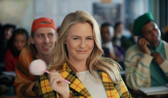 This photo provided by Rakuten Rewards shows Alicia Silverstone in a scene from Rakuten Rewards 2023 Super Bowl NFL football spot.  Big name advertisers are paying as much as $7 million for a 30-second spot during the big game on Sunday, Feb. 12, 2023. In order to get as much as a return on investment for those million, most advertisers release their ads in the days ahead of the big game to get the most publicity for their spots. (Rakuten Rewards via AP)