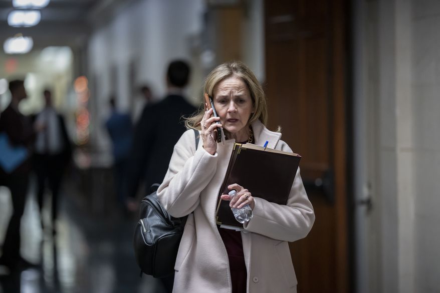 Rep. Madeleine Dean, D-Pa., arrives as Democrats hold elections for their new leadership for the next Congress, at the Capitol in Washington, Wednesday, Nov. 30, 2022. House Democratic Caucus Chair Hakeem Jeffries, D-N.Y., was elected to be the next Democratic leader. (AP Photo/J. Scott Applewhite)