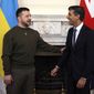 Ukraine&#39;s President Volodymyr Zelenskyy meets Britain&#39;s Prime Minister Rishi Sunak, right, inside Downing Street in London, Wednesday, Feb. 8, 2023. It is the first visit to the UK by the Ukraine President since the war began nearly a year ago. (Dan Kitwood/Pool via AP)