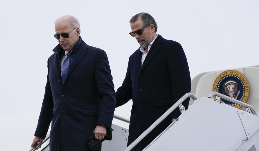 President Joe Biden and his son, Hunter Biden, step off Air Force One, Saturday, Feb. 4, 2023, at Hancock Field Air National Guard Base in Syracuse, N.Y. The Bidens are in Syracuse to visit with family members following the passing of Michael Hunter, the brother of the president&#x27;s first wife, Neilia Hunter Biden. (AP Photo/Patrick Semansky)