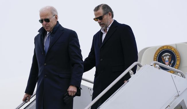 President Joe Biden and his son, Hunter Biden, step off Air Force One, Saturday, Feb. 4, 2023, at Hancock Field Air National Guard Base in Syracuse, N.Y. The Bidens are in Syracuse to visit with family members following the passing of Michael Hunter, the brother of the president&#x27;s first wife, Neilia Hunter Biden. (AP Photo/Patrick Semansky)