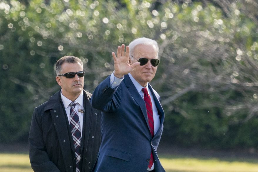 President Joe Biden waves before boarding Marine One on the South Lawn of the White House, Wednesday, Feb. 8, 2023, in Washington. Biden is traveling to Wisconsin. (AP Photo/Alex Brandon)