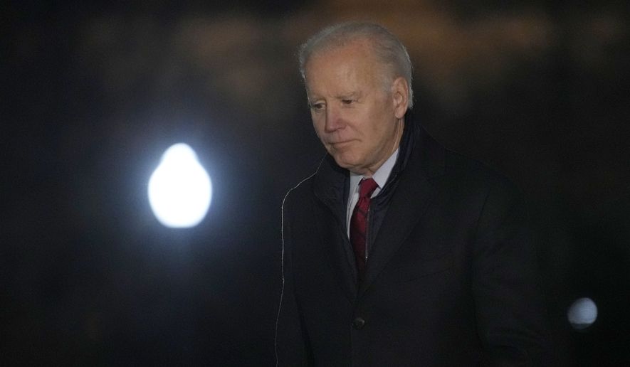President Joe Biden walks off of Marine One on the South Lawn of the White House in Washington, Wednesday, Feb. 8, 2023, after returning from a trip to Wisconsin. (AP Photo/Susan Walsh)