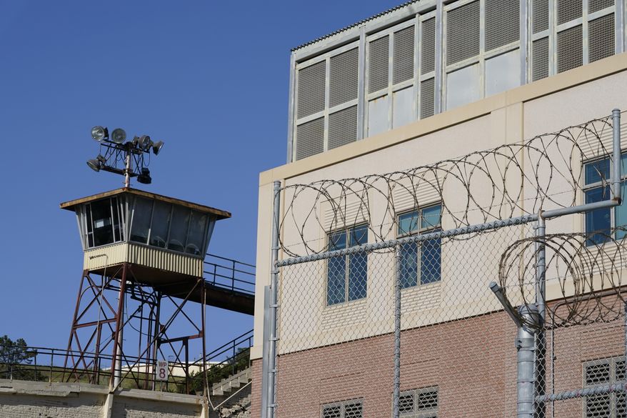 Barbed wire and a guard tower is seen at San Quentin State Prison on April 12, 2022, in San Quentin, Calif. California could reinstate voting rights to felons while they are in prison in a major expansion of suffrage for incarcerated people if a bill currently before the state legislature passes despite an uphill battle. (AP Photo/Eric Risberg,File)