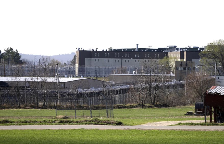 The Souza-Baranowski Correctional Center is surrounded by fencing, Wednesday, April 19, 2017, in Lancaster, Mass. A proposal to let Massachusetts prisoners donate organs and bone marrow to shave time off their sentence is raising profound ethical and legal questions about putting undue pressure on inmates desperate for freedom. (AP Photo/Elise Amendola, File)