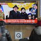 A TV screen shows an image of North Korean leader Kim Jong-un with his daughter during a news program at the Seoul Railway Station in Seoul, South Korea, Thursday, Feb. 9, 2023. Kim brought his young daughter to a huge military parade showing off the latest hardware of his fast-growing nuclear arsenal, including intercontinental ballistic missiles designed to reach the United States, state media said Thursday. (AP Photo/Lee Jin-man)