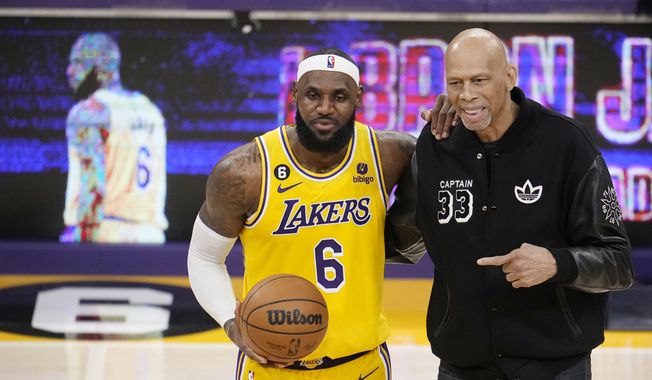 Los Angeles Lakers forward LeBron James, left, poses for a photo with Kareem Abdul-Jabbar after James become the NBA&#x27;s all-time leading scorer during the second half of an NBA basketball game against the Oklahoma City Thunder Tuesday, Feb. 7, 2023, in Los Angeles. (AP Photo/Marcio Jose Sanchez) **FILE**