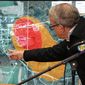FILE - Ohio Gov. Mike DeWine points to a map of East Palestine, Ohio that indicates the area that has been evacuated as a result of Norfolk Southern train derailment, after touring the site, Feb. 6, 2023, in East Palestine, Ohio. After toxic chemicals were released into the air from a wrecked train in Ohio, evacuated residents remain in the dark about what toxic substances are lingering in their vacated neighborhoods while they await approval to return home. (AP Photo/Gene J. Puskar)